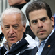 Then-Vice President Joe Biden, left, and his son Hunter Biden, right, at a women's ice hockey preliminary game between the U.S. and China at UBC Thunderbird Arena in Vancouver, Canada, on February 14, 2010.